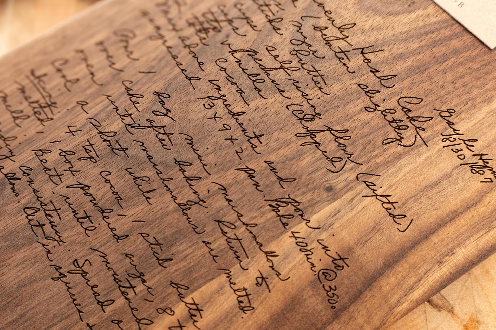 Custom handwritten recipe display on wood cutting board, perfect for kitchen decor and wall decoration. Laser engraving preserves family heirlooms and grandmother keepsakes as heritage kitchen art. A unique memorial gift idea featuring personalized design and engraving for a timeless display and keepsake.