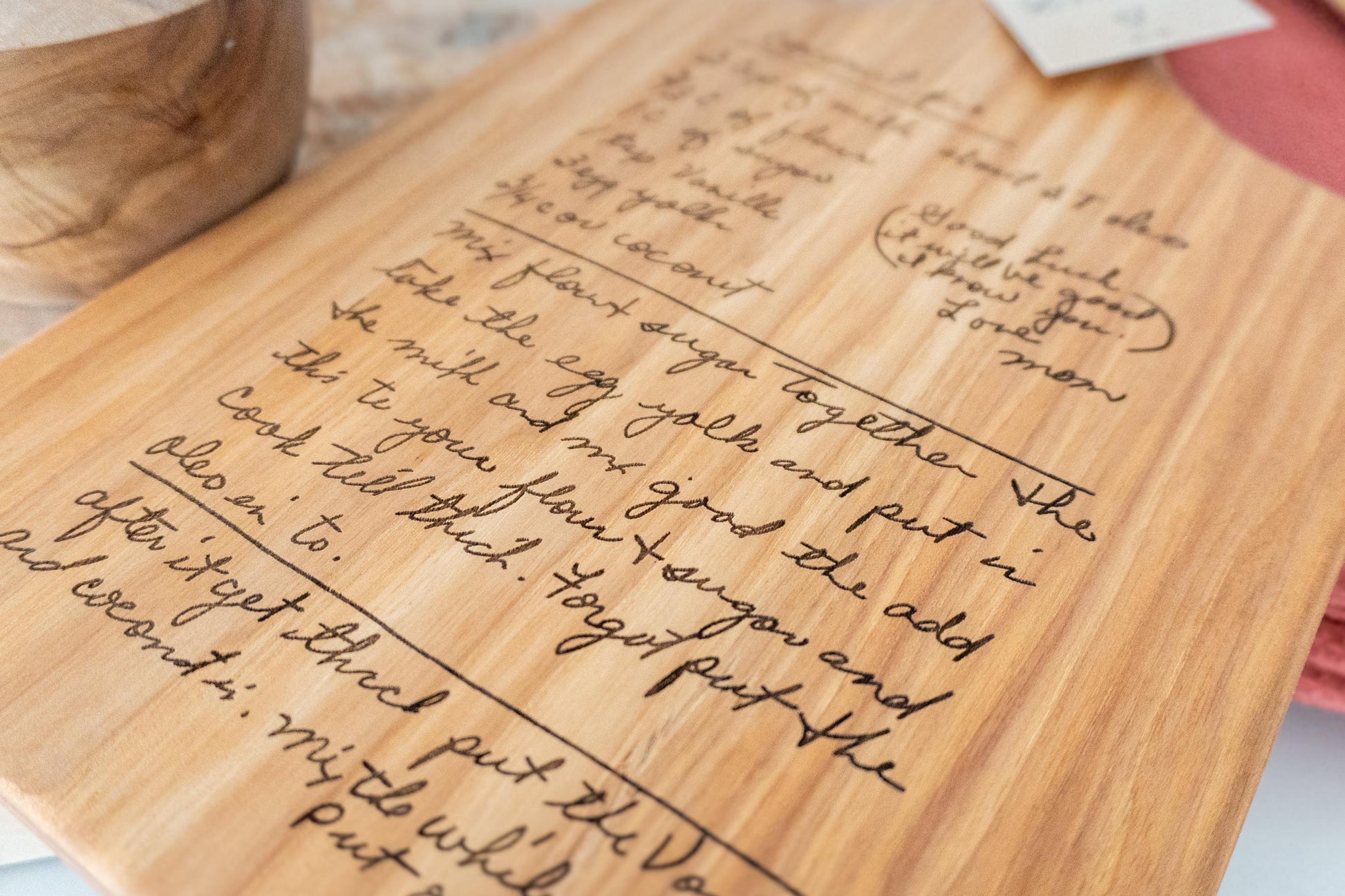 Custom handwritten recipe display on wood cutting board, perfect for kitchen decor and wall decoration. Laser engraving preserves family heirlooms and grandmother keepsakes as heritage kitchen art. A unique memorial gift idea featuring personalized design and engraving for a timeless display and keepsake.