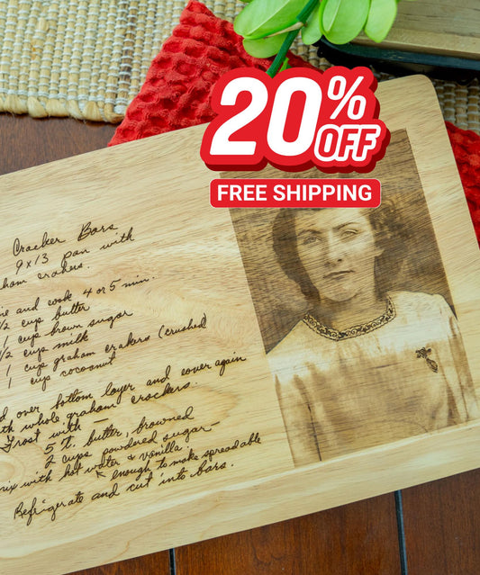 A wooden cutting board with a handwritten recipe for "Graham Cracker Bars" and a vintage photo of a woman. The recipe includes ingredients like butter, sugar, graham crackers, and coconut.